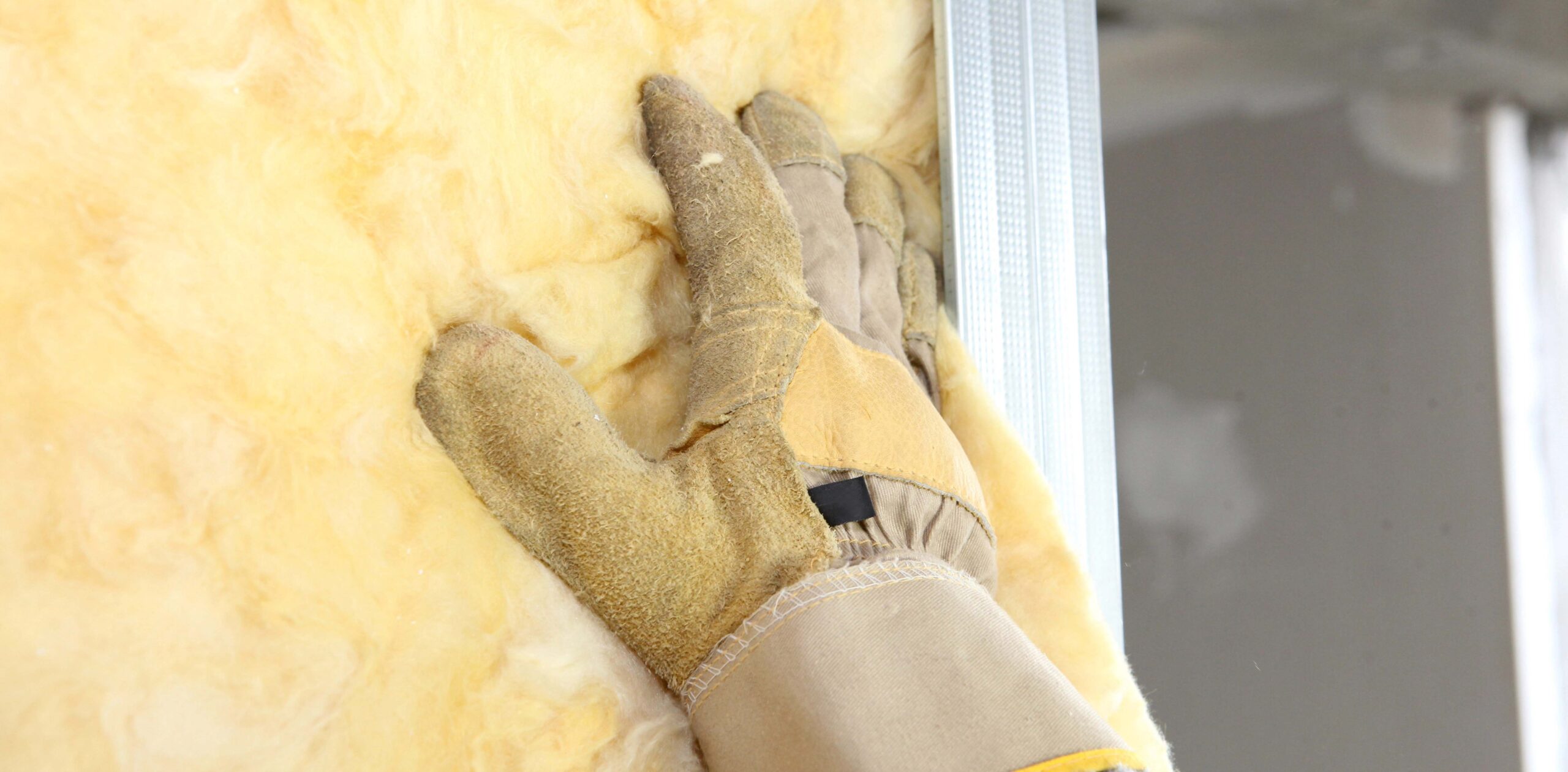 Gloved hand on insulation batts vs rolls